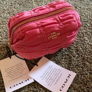 Pink Coach cosmetic bag